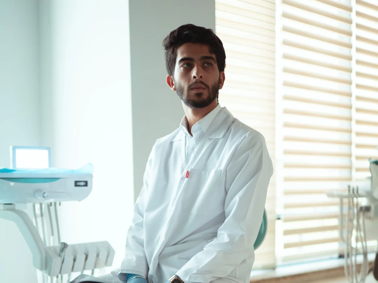 Dentist portrait in a white coat at Habibler Clinic
